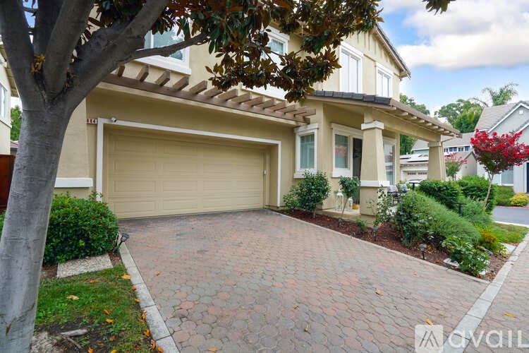 A house with a garage and a driveway.