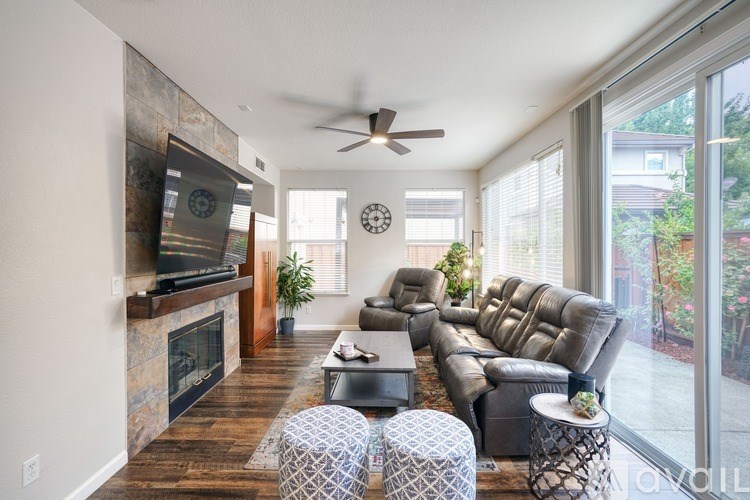 A living room with a fireplace and a large couch.