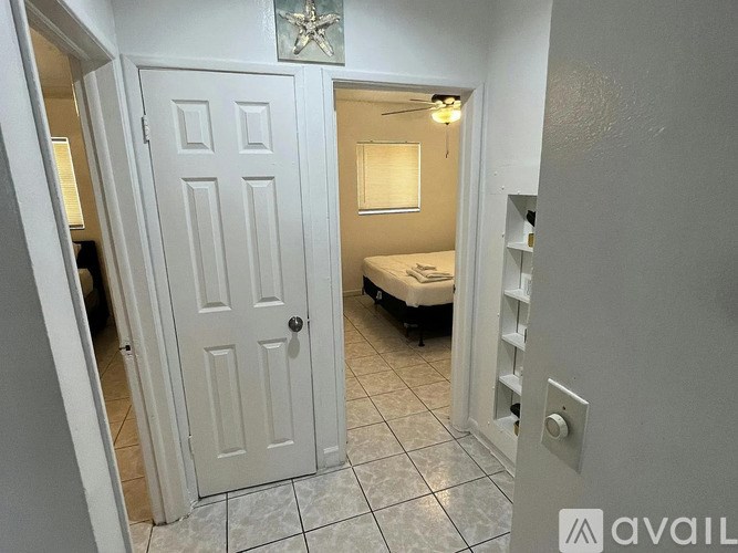 A white door with a star decoration above it.