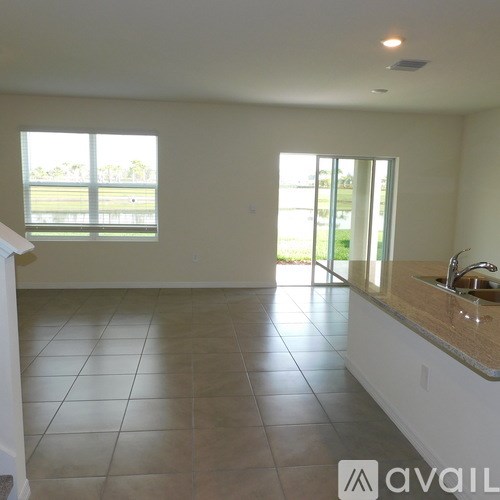 A kitchen with a sink and a window.