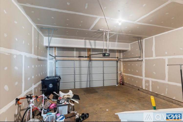 A room under construction with a lot of tools and materials scattered around.