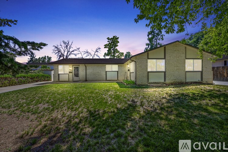 A house with a lawn in front of it is available for sale.