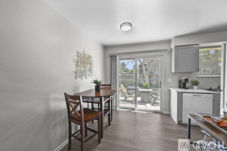 A dining room with a table and chairs is shown.