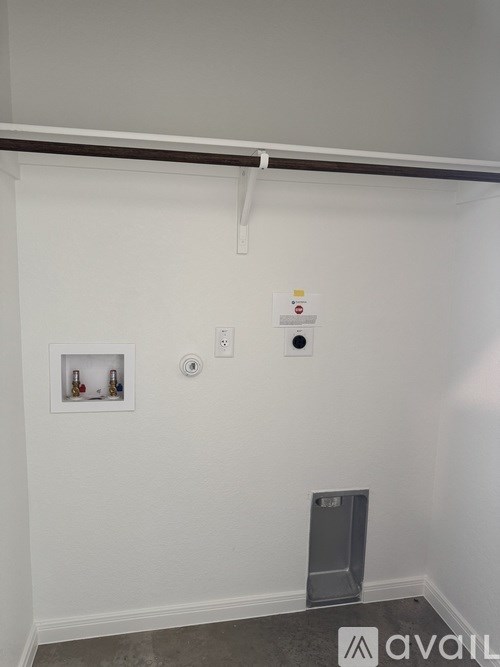 A wall with a picture and a speaker on it.