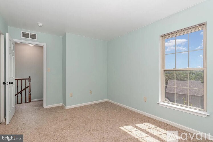 A room with a window and a door.