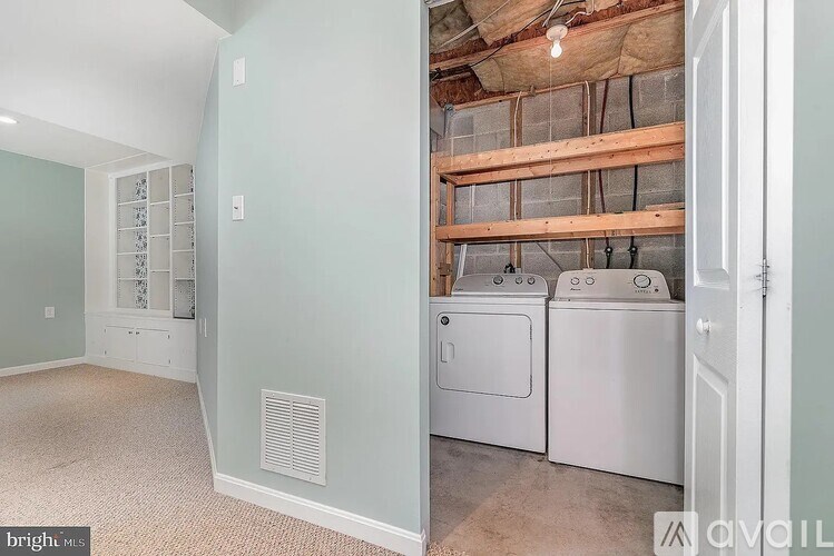 A laundry room with a washer and dryer.