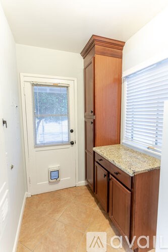 A small room with a door and a window.