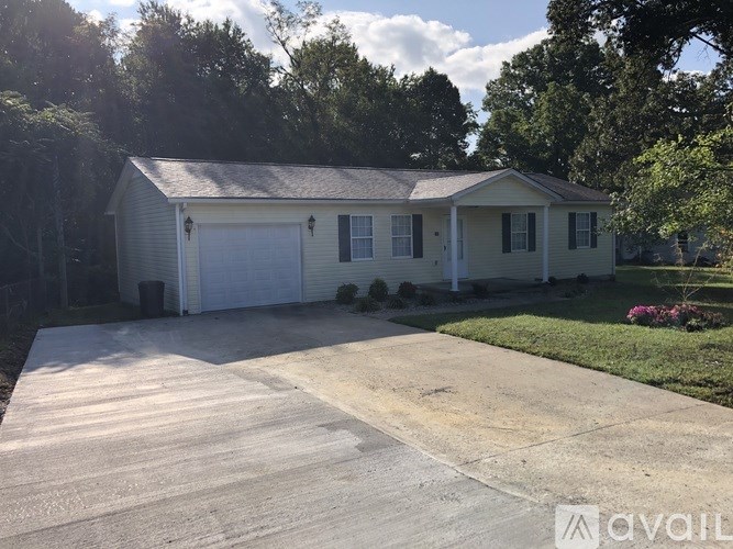 A two-car garage is attached to a house.