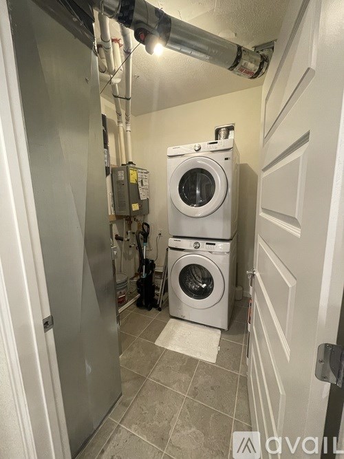 A washer and dryer in a small laundry room.