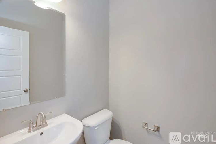 A bathroom with a toilet and sink.