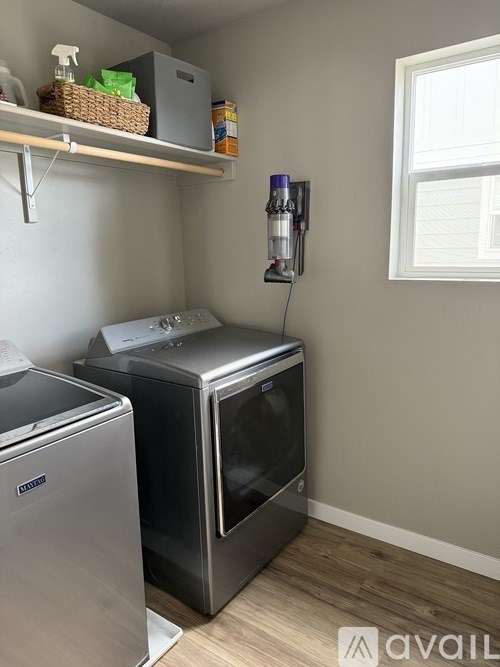 A small kitchen with a dishwasher and a microwave.