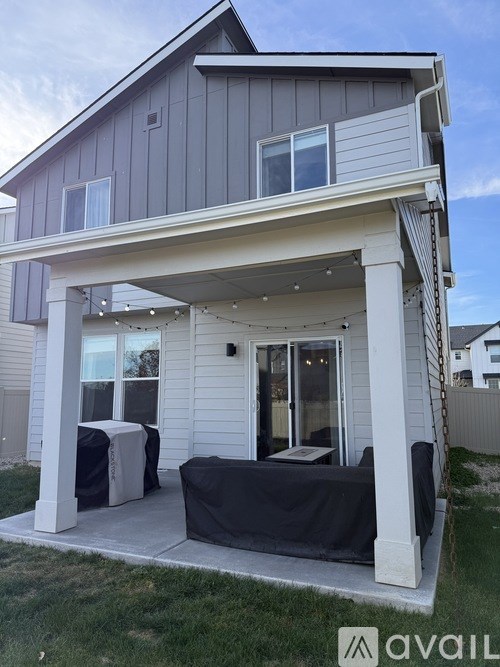 A house with a covered patio area.