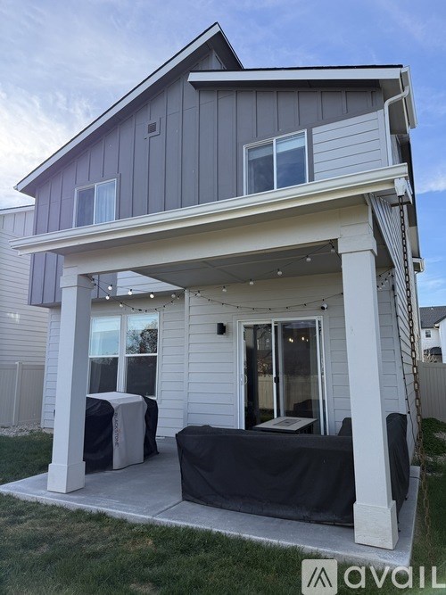 A house with a covered patio area.