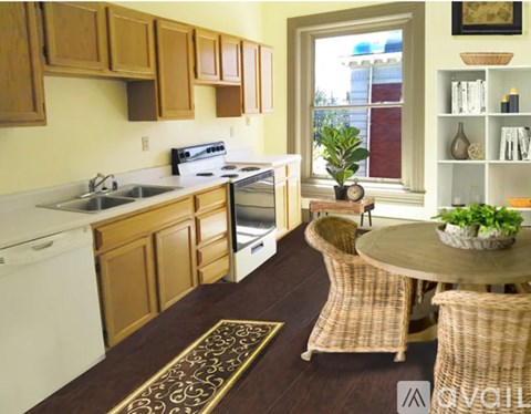 A kitchen with wooden cabinets and a white dishwasher.