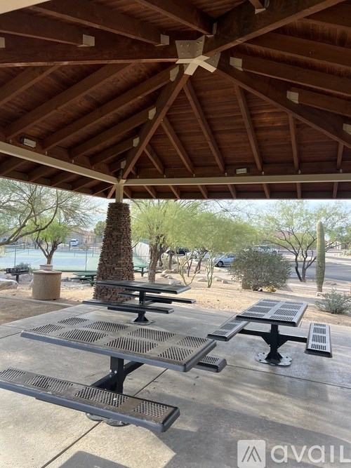 A bathroom with a sink, toilet, and a mirror.