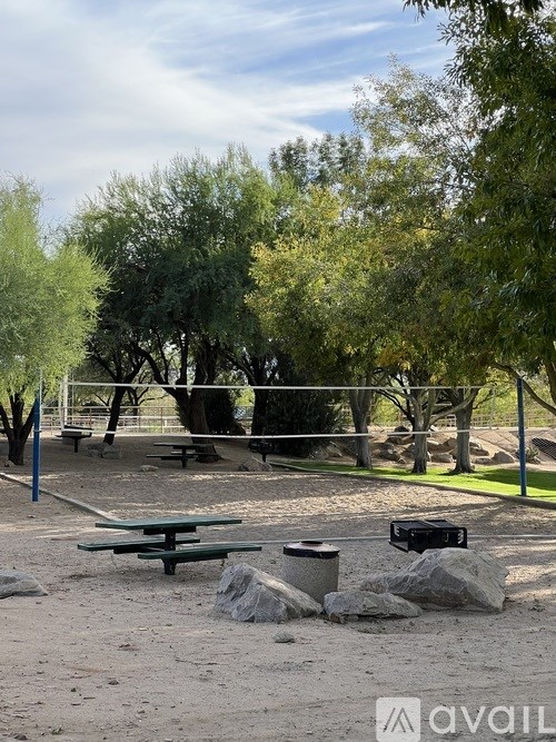 A stainless steel refrigerator with two doors is in a kitchen.