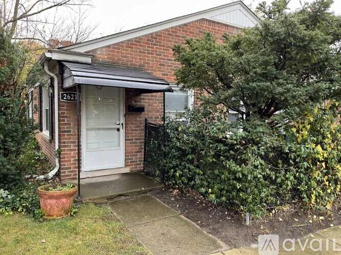 A house with a white door and a small porch.