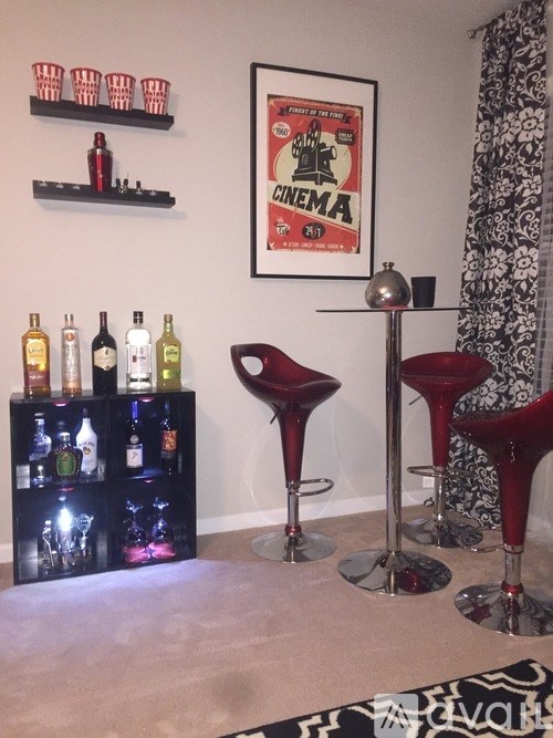 A bar area with a cinema poster on the wall.