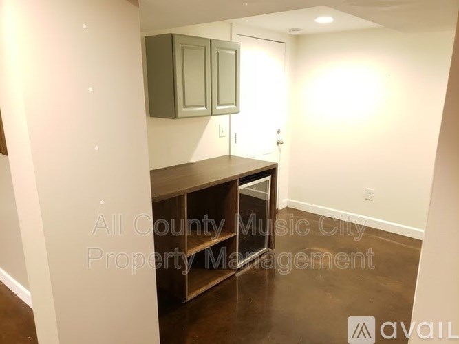 A room with a cabinet and a shelf in it.