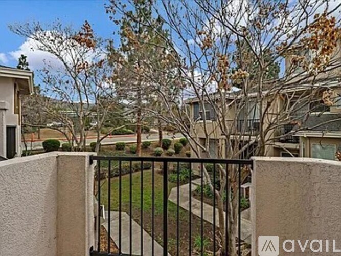A black metal fence in front of a house.
