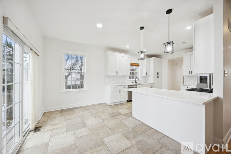 A spacious kitchen with a large island in the middle.