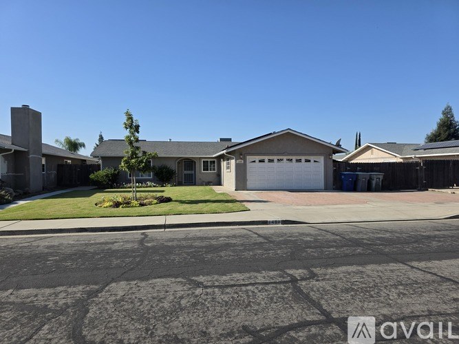 A residential area with houses and a clear sky.