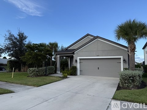 A house with a garage and a driveway.