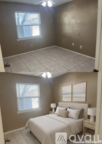 A bedroom with a bed, nightstand, and window.