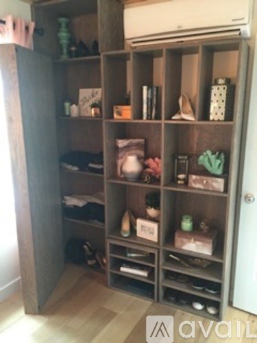 A room with a large closet and a door.