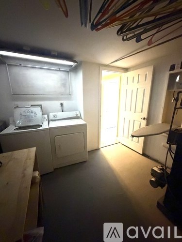 A room with a white cabinet and a white door.