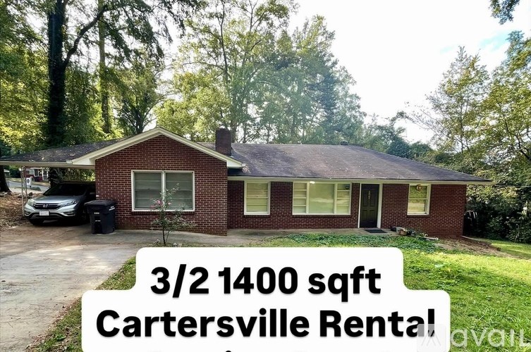 A sign in front of a house advertises a 3/2 1400 sqft Cartersville Rental.