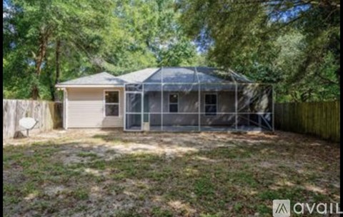 A house with a screened in porch is for sale.