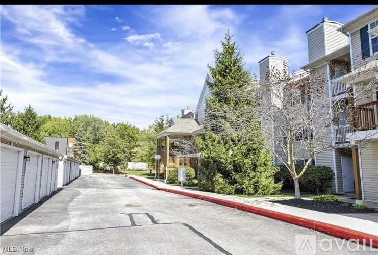A sunny day at a residential complex with a clear blue sky.