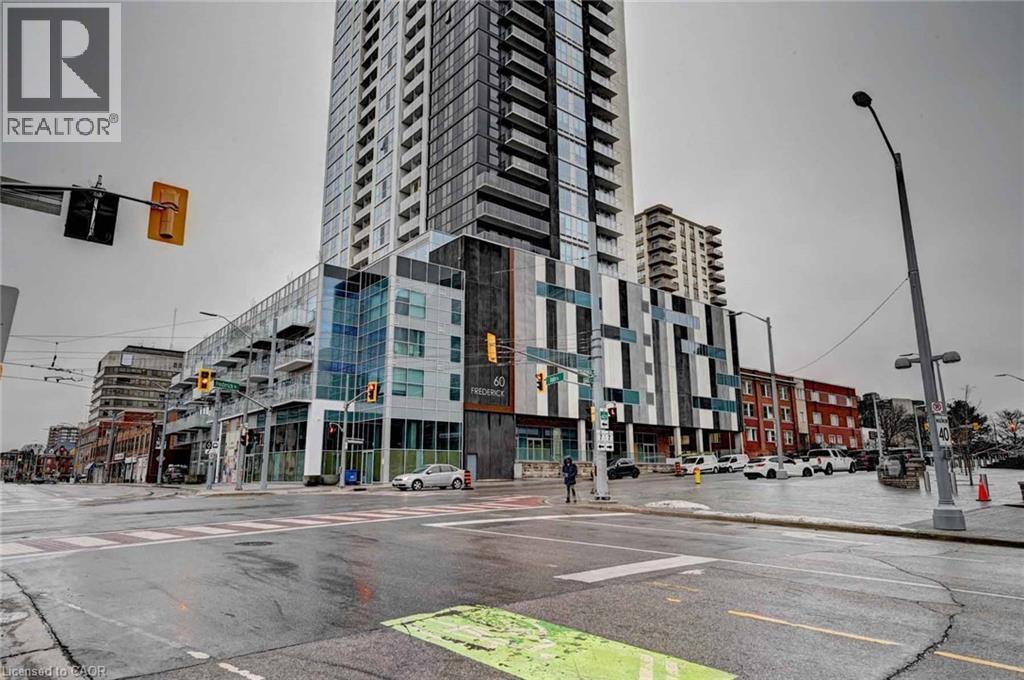 A city street with a REALTOR® sign on a building.
