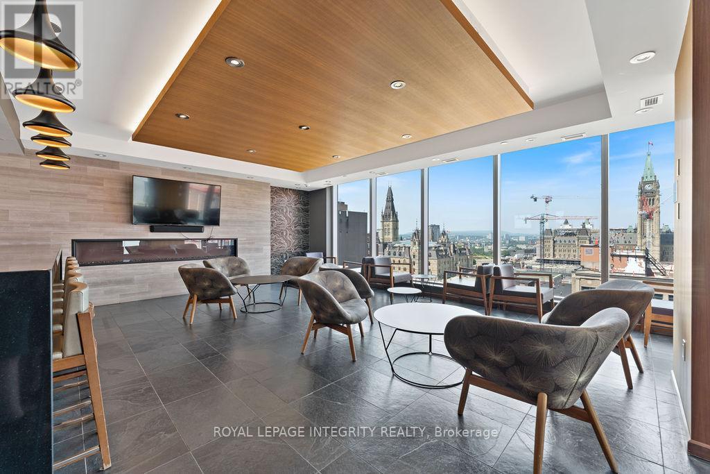 A modern living room with a view of the city skyline.