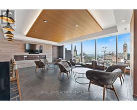 A modern living room with a view of the city skyline.