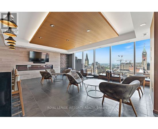 A modern living room with a view of the city skyline.