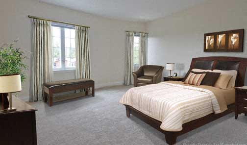 a bedroom with a bed and a chair and a window