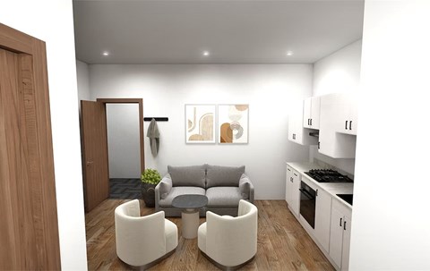A modern living room with a grey couch and a wooden door.