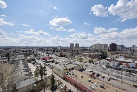 A cityscape with buildings and cars.