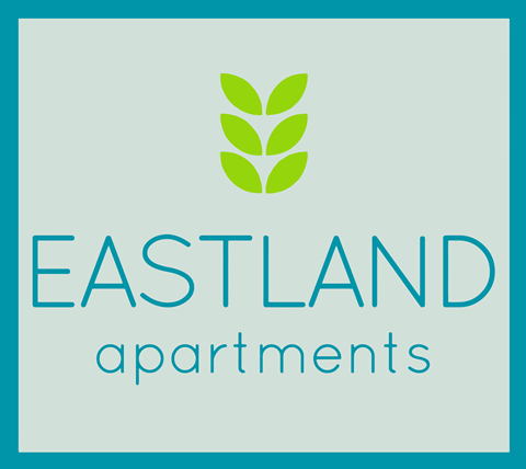 A logo for Eastland Apartments featuring a green leaf.