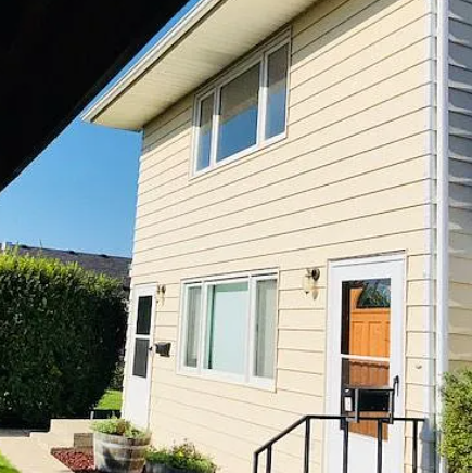 A house with a white door and a small porch.