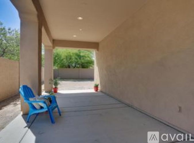 A blue chair is on a patio.