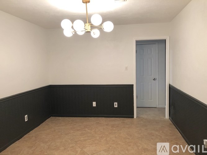 A room with a door and a light fixture.