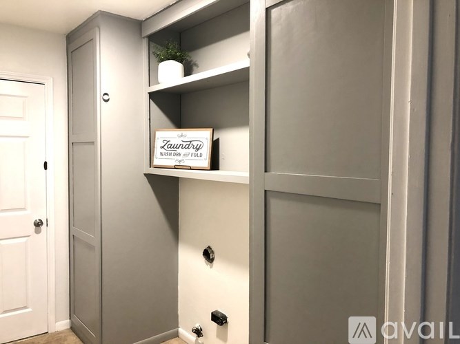 Laundry sign on a shelf in a laundry room.