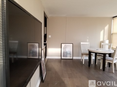 A modern kitchen with a dining table set up.