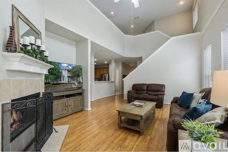 A living room with a fireplace and a couch.