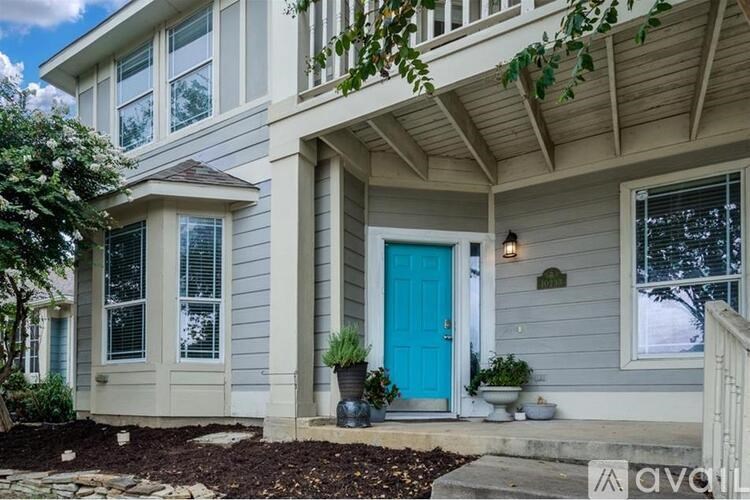 A house with a blue door and a porch.