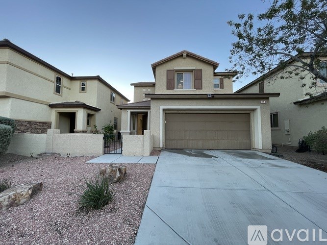 A house with a driveway in front of it.