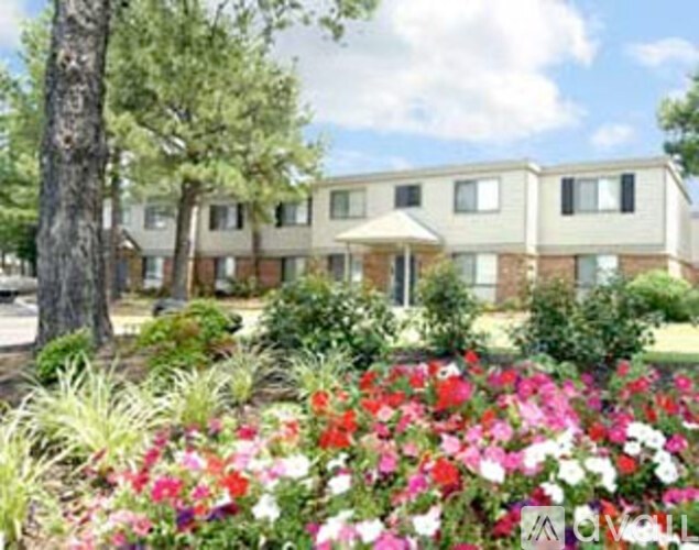 A building with a garden in front of it.